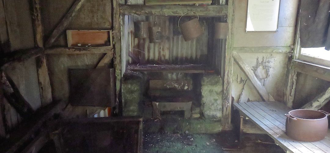 The interior of the hut has some accoutrements from ancient times. |  Beech Hut, Milford Track