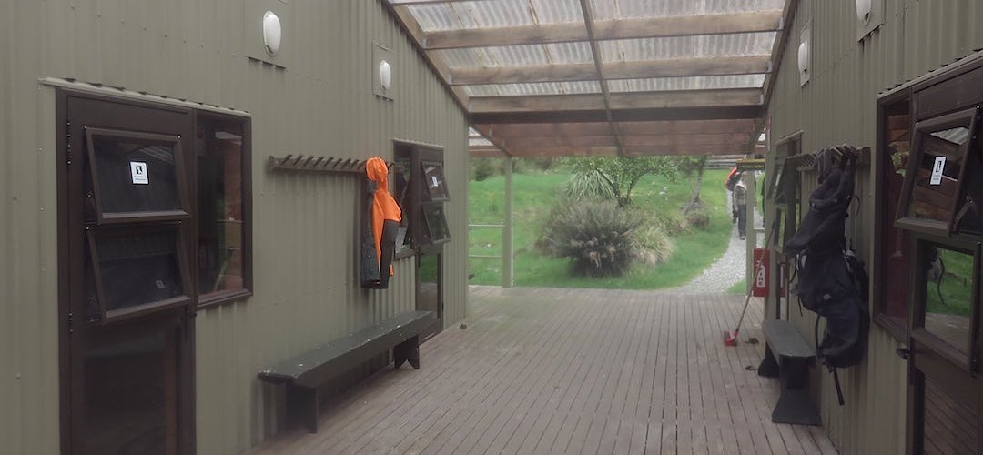 The giant verandahs are useful in the wet down at the sleeping quarters.  | Dumpling Hut, Milford Track