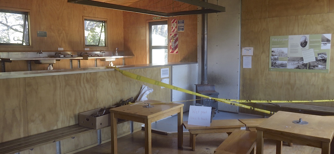 The fireplace hearth is touched up prior to the summer season starting. |  Routeburn Falls Hut, Routeburn Track