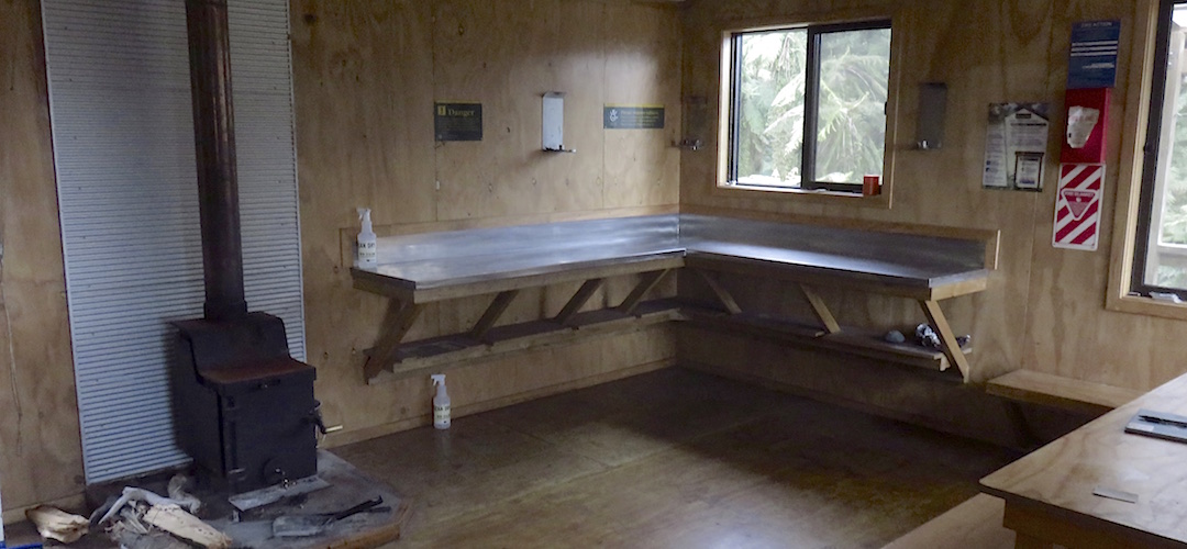 Kitchen bench and firebox, ie, the usual. | Hokuri Hut, Hollyford Track