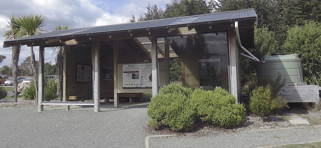 The shelter has some information panels inside.  | Lake Te Anau control gates shelter, Kepler Track