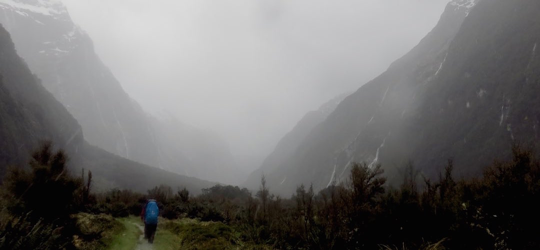 It's rather wet and you can't make out all those waterfalls, but there are walls of them. | Milford Track, Fiordland National Park