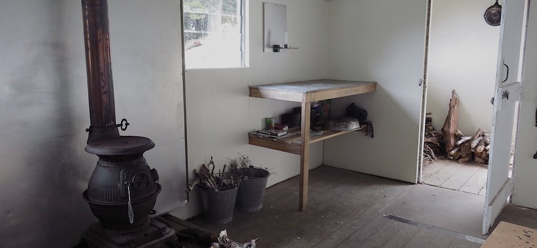 The tiny kitchen bench, must be crowded when the hut is full.  | Richmond Saddle Hut, Mt Richmond Forest Park