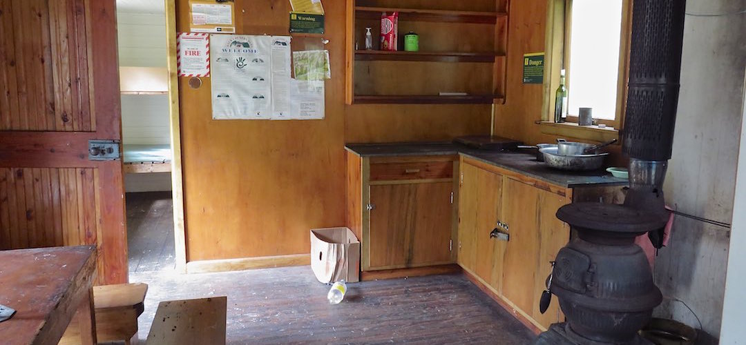 kitchen area and pot belly stove | Three Mile Stream Hut, Lake Sumner Forest Park