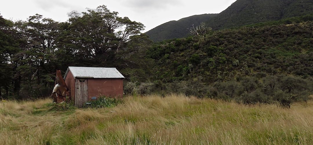 the hut is set on a river terrace | Doubtful Hut, Lake Sumner Forest Park