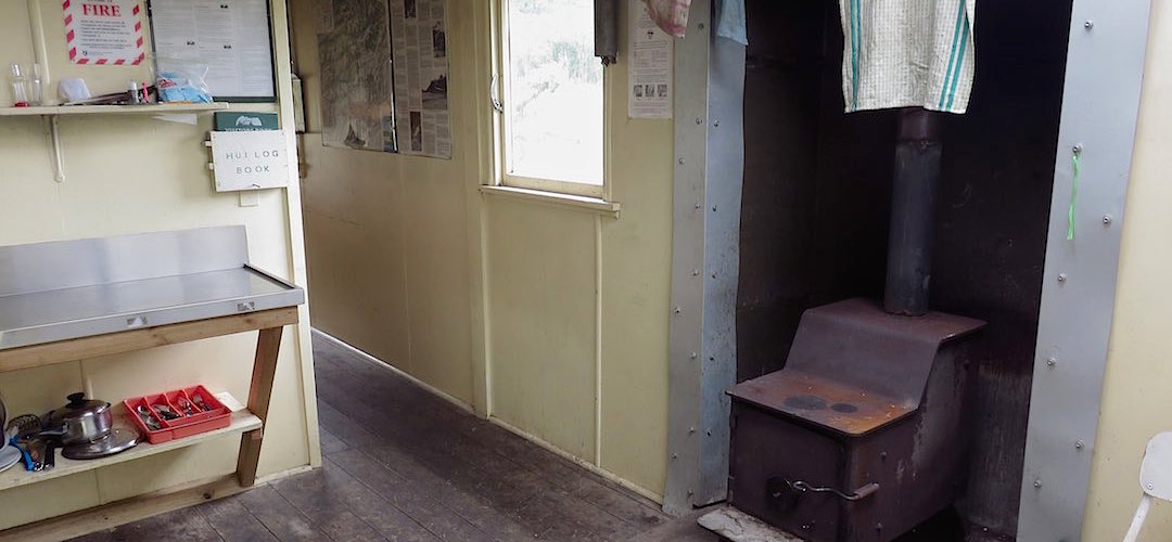firebox is in the kitchen area | St Jacobs Hut, Lake Sumner Conservation Area