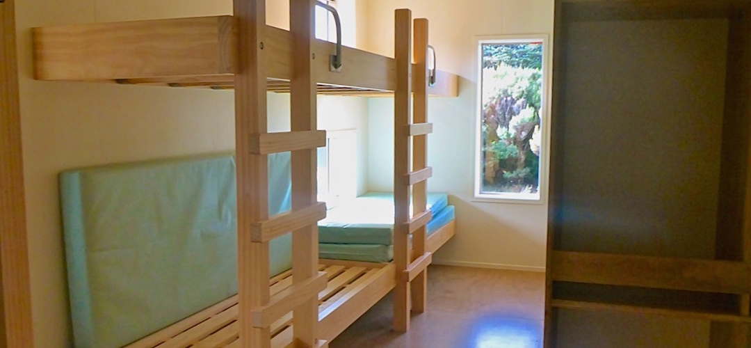 Bunkroom with storage area. photo by David Guppy | James MacKay Hut, Heaphy Track, Kahurangi National Park
