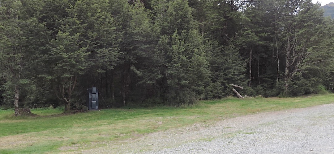 There's some flat ground with grass and a long drop toilet | Klondyke Corner campsite, Arthurs Pass National Park