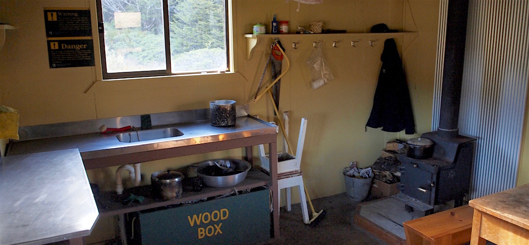 Lots of bench space, but you get your water from the stream.  |  Boulder Lake Hut, Kahurangi National Park