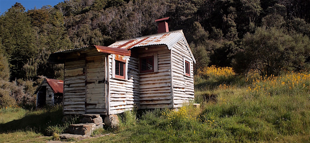 The exterior walls are constructed from nearby fallen trees.  |  Chaffey Hut, Kahurangi National Park