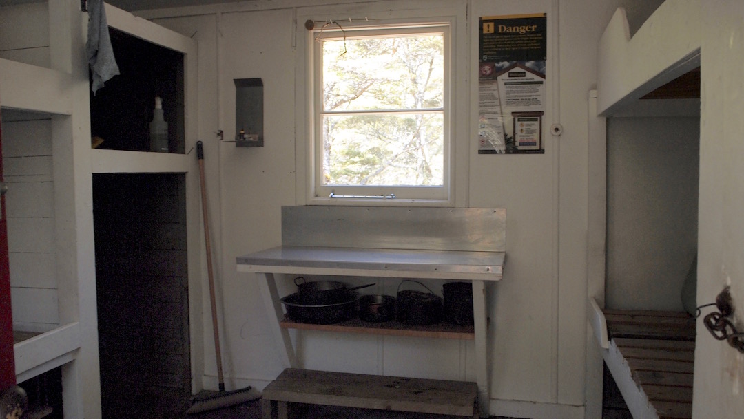 There is a small bench and the four bunks, and some storage areas. |  Cobb Hut, Kahurangi National Park