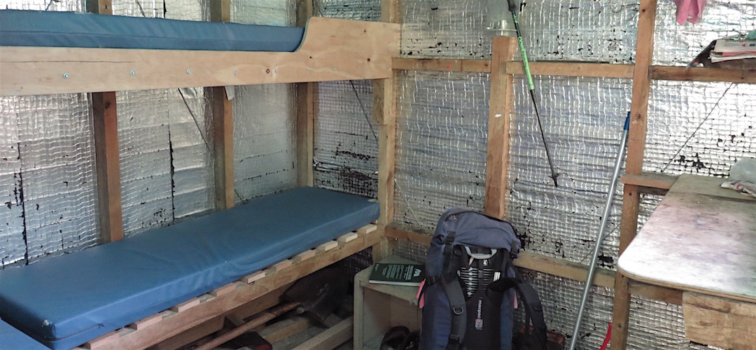 The interior is rather compact, but okay for three people, I guess. |  Lonely Lake Hut, Kahurangi National Park