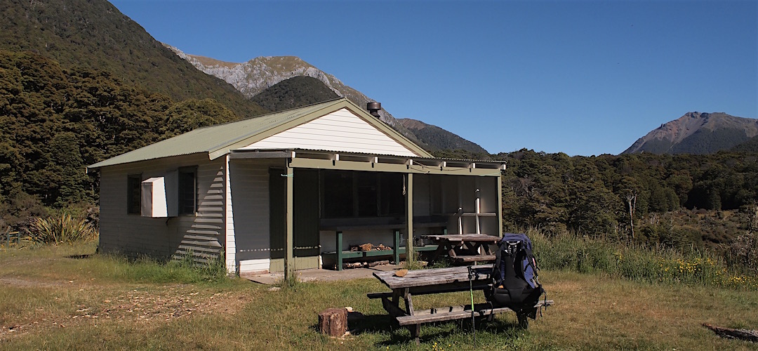 It's a fairly good setting with a decent view of the mountains around. | Trilobite Hut, Kahurangi National Park