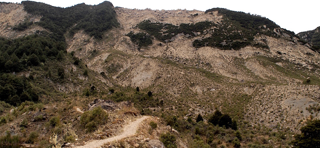 Slow going through the rockfall area, zigzagging, major rocks hanging above.