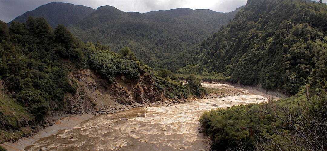 The Mokihinui River was way up, churning and looking way ugly. | Old Ghost Road