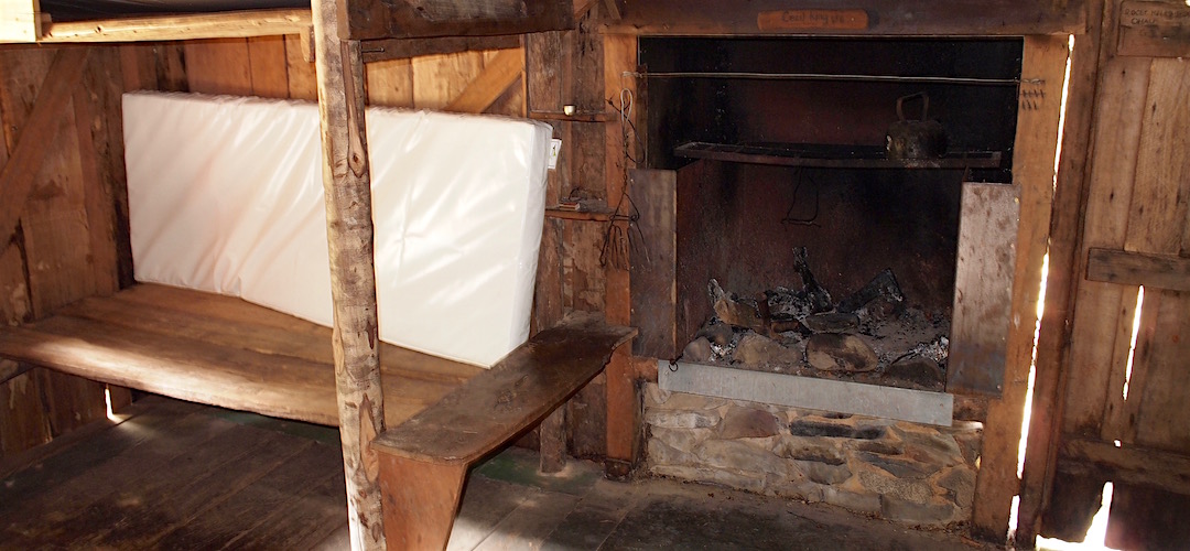 The fireplace and bunks. | Cecil Kings Hut, Wangapeka Track, Kahurangi National Park