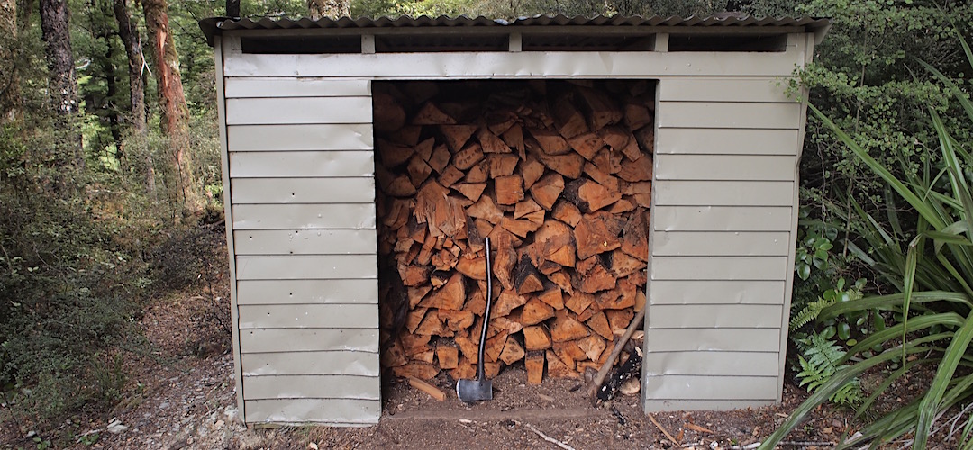 A fallen tree has meant that the wood shed is now full. | King Creek Hut, Wangapeka Track, Kahurangi National Park