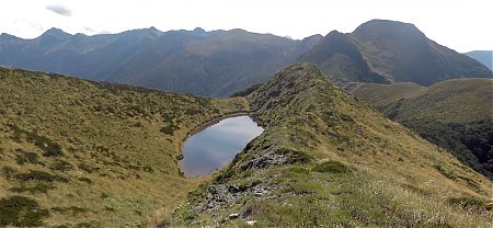 That's Nugget Knob on the left and the ridge that's just been travelled. | Matiri Ridge Tarn campsite