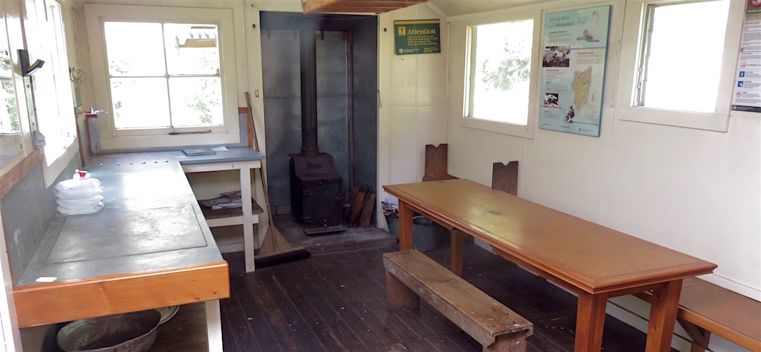Lots of bench and a decent table. | Stone Hut, Wangapeka Track, Kahurangi National Park