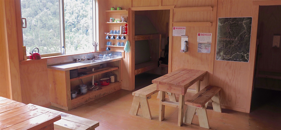 Benchspace . . . prepare to fight for it. | Specimen Point Hut, Mohikinui Ecological Area