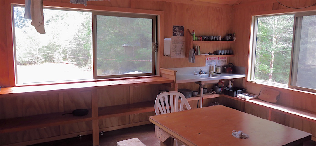 Cooking on timber, don't worry about it. At least there's decent bench space here. | Stern Valley Hut, Lyell Range/Radiant Range Conservation Area