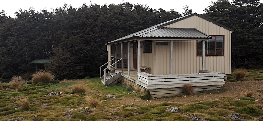 There's a great outdoor sitting area, if it's sunny. | Sylvester Hut, Kahurangi National Park
