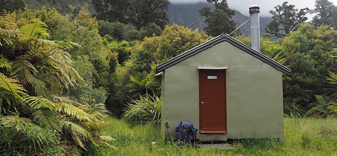 The exterior has been recently reconditioned, well, painted. | Rapid Creek Hut, Hokitika River, West Coast