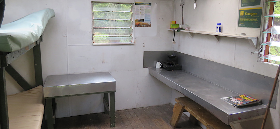 Good kitchen bench and flyscreens to windows. | Rapid Creek Hut, Hokitika River, West Coast