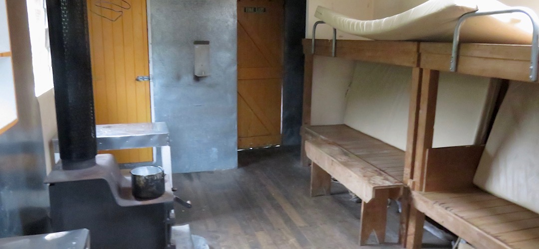 Woodburner and bunks are standard these days. | Top Toaroha Hut, Toaroha River, West Coast