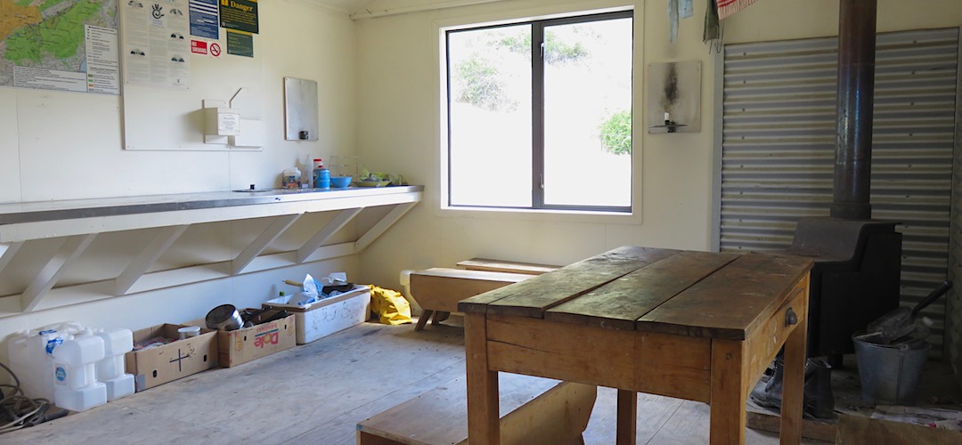 Lots of bench space, and abandoned rubbish. | Forbes (Seymour) Hut, Clarence River
