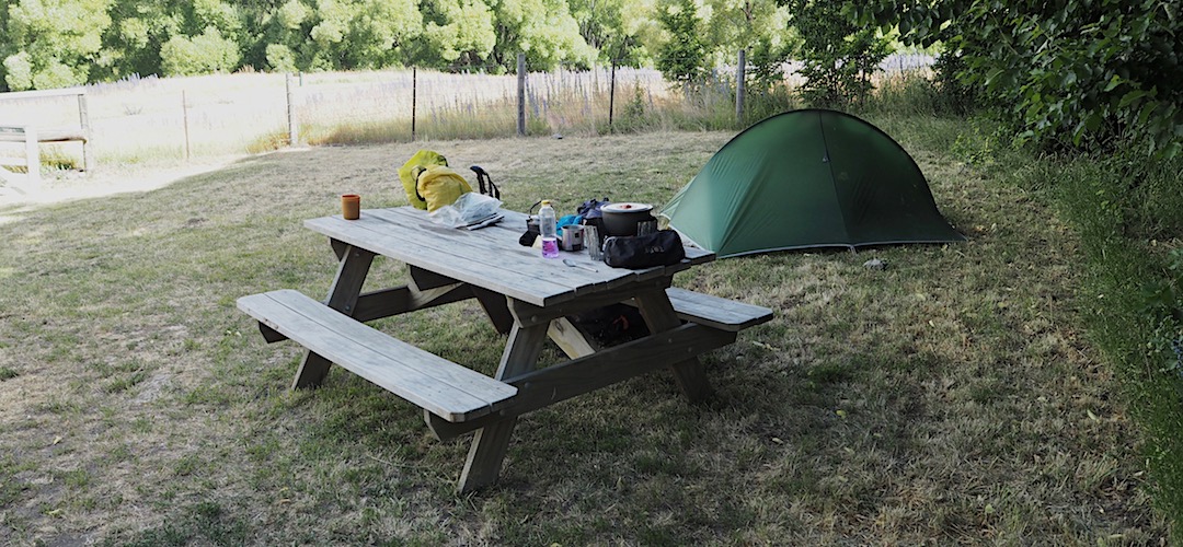 One part of the camp ground has some sheltered sites. The picnic table is the camper's jackpot.  | Molesworth Cob Cottage campsite, Molesworth