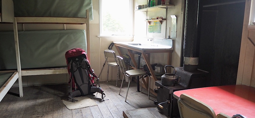 Someone has added some Formica furniture that beats the old timber benches for comfort. | Steyning Hut, Lake Sumner Forest Park