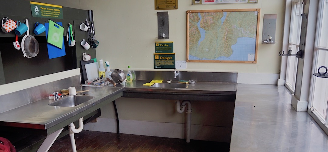 Decent bench space and a tap for the sink.  |  Port Craig Schoolhouse Hut, near Fiordland National Park