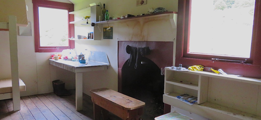 Typical S70 NZFS hut complete with open fire. | Paske Hut, Paske River