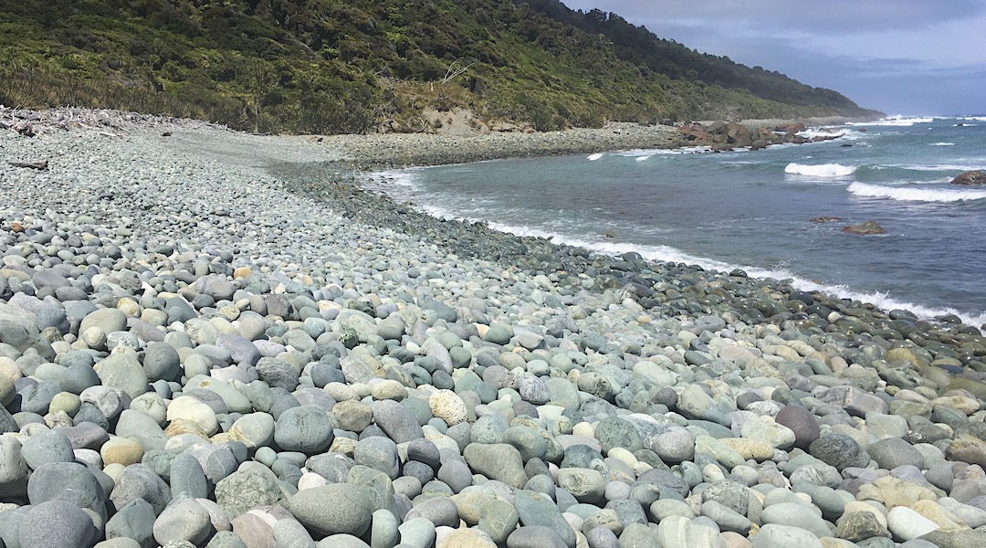 Typical beach walking down the coast. Ain't so easy with a heavy pack. | Cascade to the Hollyford Track, South Westland