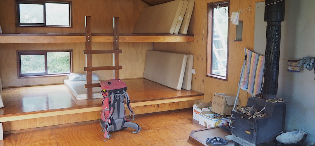 Two-level sleeping platform with ten mattresses.  | Grassy Flat Hut, Styx River, West Coast