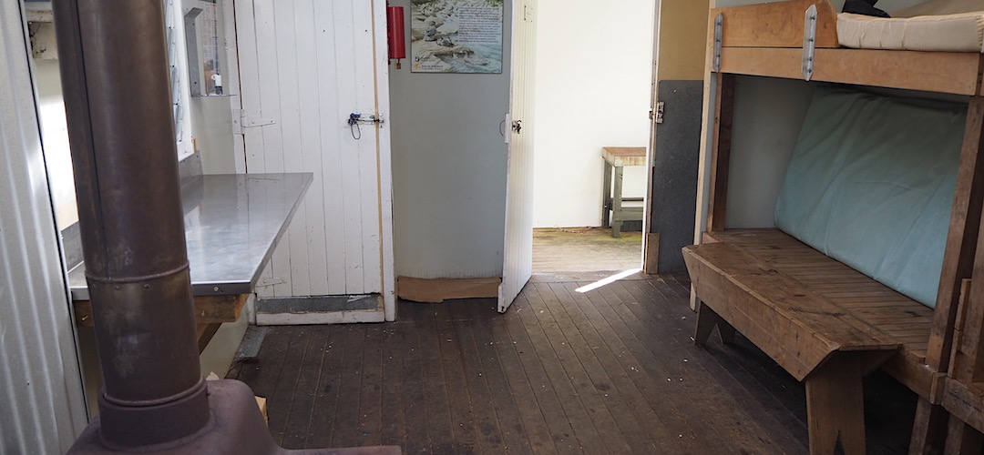 A porch is useful protection. | Mudflats Hut, Arahura River, West Coast