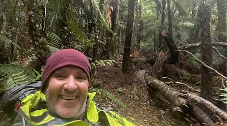 Climbing from Pigeon Saddle in the rain. Abel Tasman National Park