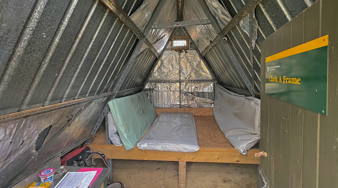 Interior with the sleeping platform and mattresses. Clark A Frame
