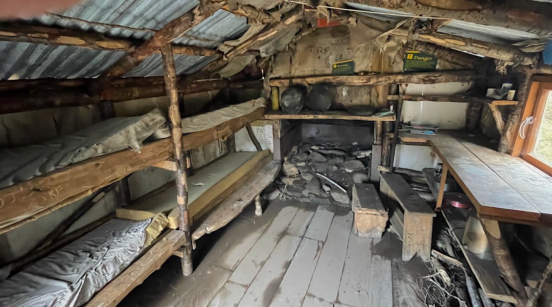 Fireplace and bunks. Clark Hut historic