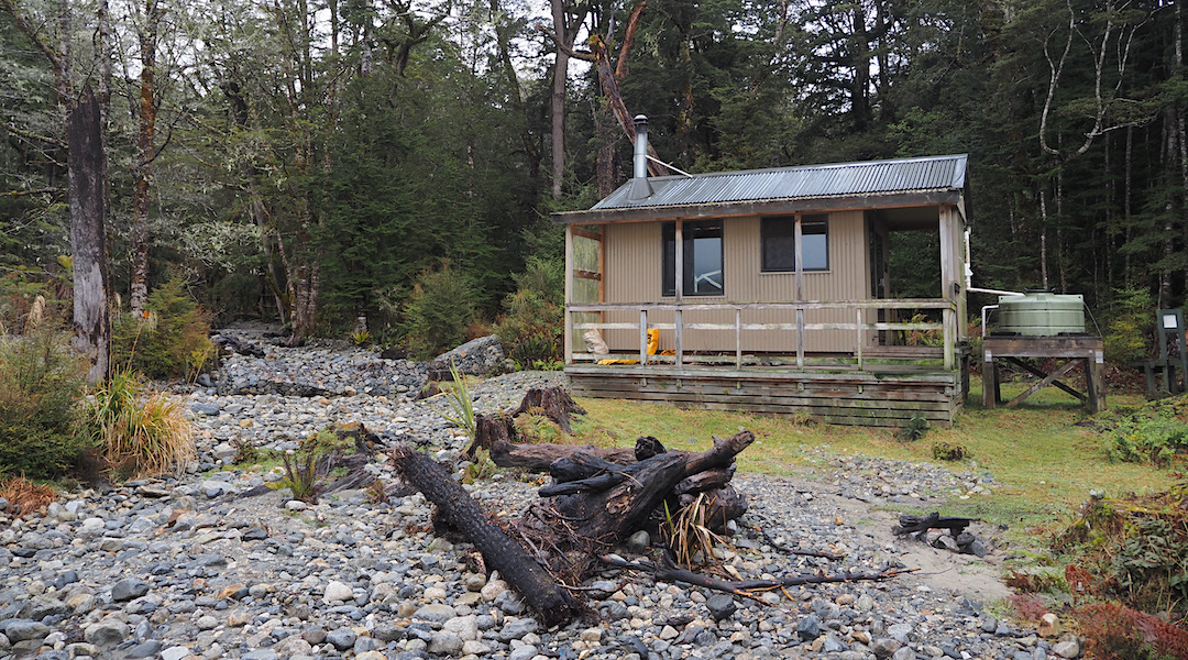 The stream rips right past the hut when in flood. | Rodger Inlet Hut