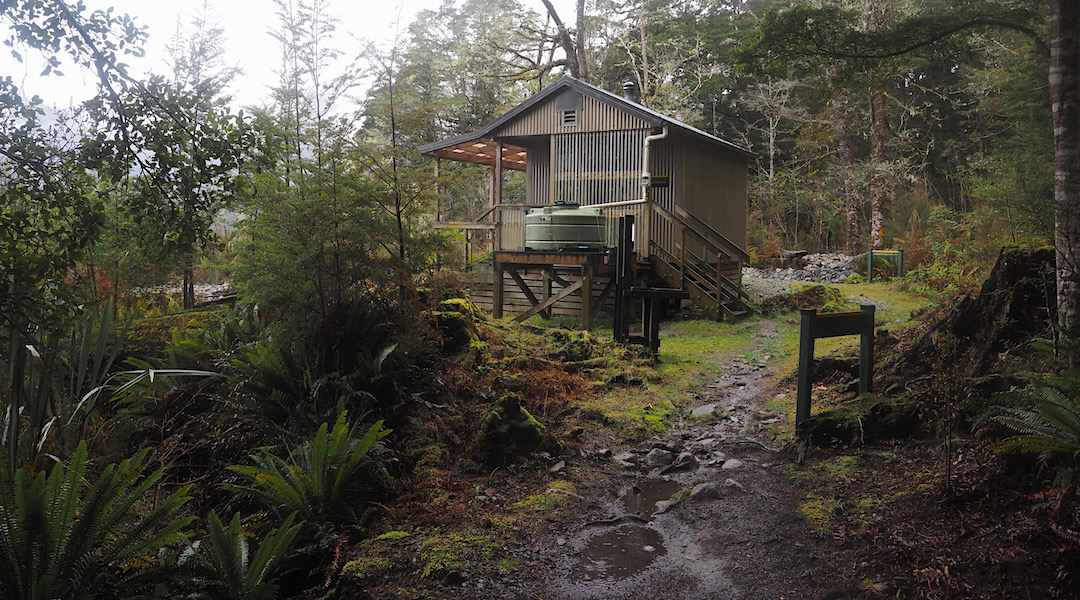 Plenty of verandah, and a small water tank. | Rodger Inlet Hut
