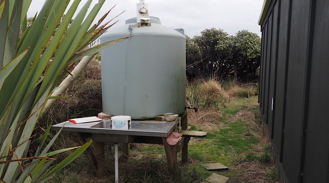 Rainwater tank and sink. | Little Hellfire Hunters Hut, Rakiura National Park