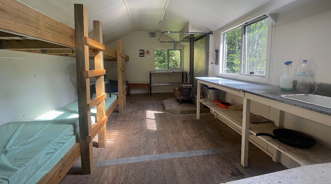 Oregon wood burner, new aluminium framed windows, and new bunks. | Barber Hut, South Marlborough