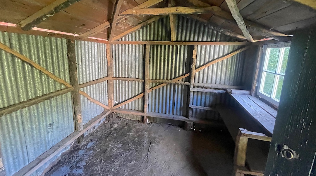 Lots of ancient graffiti internally, and a dirt floor. | Old Boulder Forks Hut, South Marlborough