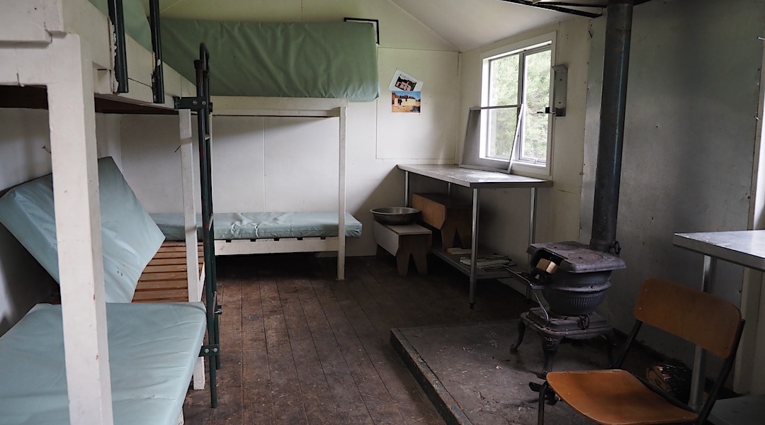 Six bunks and an Oregon wood burner. | Caves Hut, South Marlborough