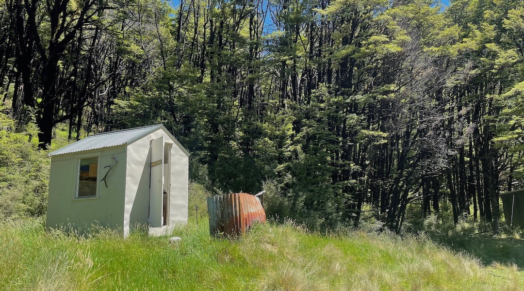 Branch Bivvy is nestled against the forest.  |  Branch Bivvy, Branch River, Marlborough