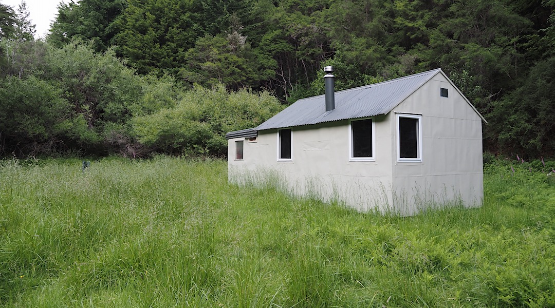 Surrounded by beech and conifer forest. |  Siberia Hut, Branch River, Marlborough