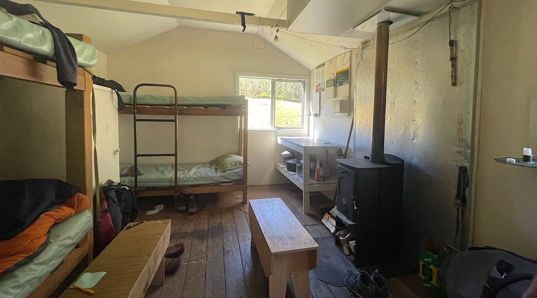 A large four-bunk hut with a new woodburner. |  Top Misery Hut, Branch River, Marlborough