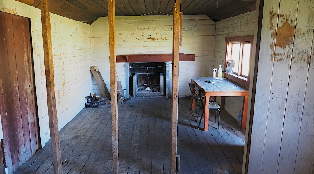 The linings on one wall have been removed. | Fowlers Hut, St James Conservation Area